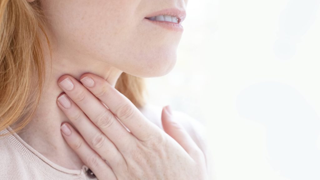 Woman with sore throat